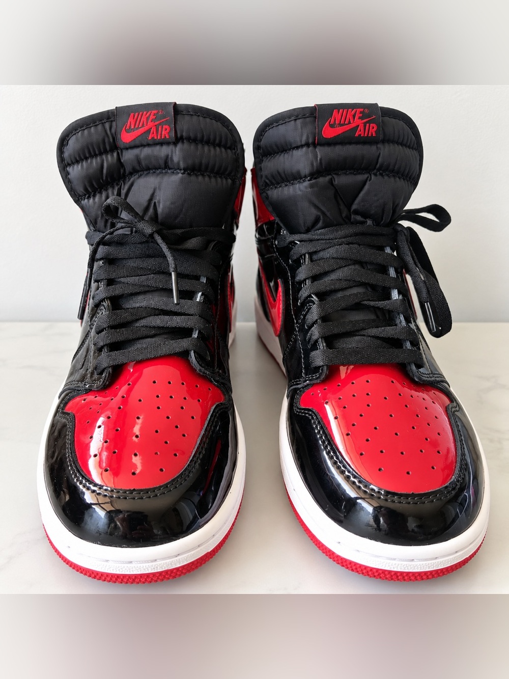 1985 men’s Nike Air Jordan 1 High Retro - Black/Red Patent Leather